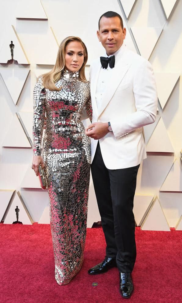 Jennifer Lopez in a mirrored gown and Alex Rodriguez in a black and white suit