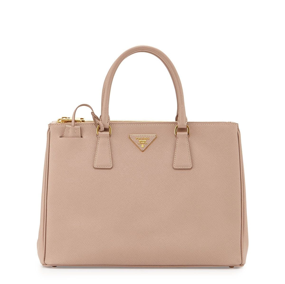 Even before she was a member of the royal family, style icon Kate always knew how to add an air of sophistication to her outfits. In her younger days, a neutral-hued Prada purse was a regular accessory. If you're really looking to make someone's gift-opening dreams come true this year, this luxury bag could be just the ticket!
<b>Prada Saffiano Medium Double Zip Top-Handle Bag</B>, $2500, Saksfifthavenue.com