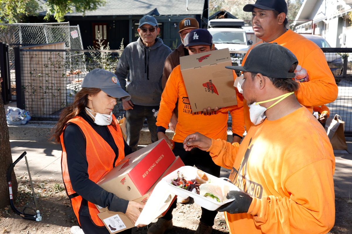 Eva Longoria distributing care packages to workers and volunteers