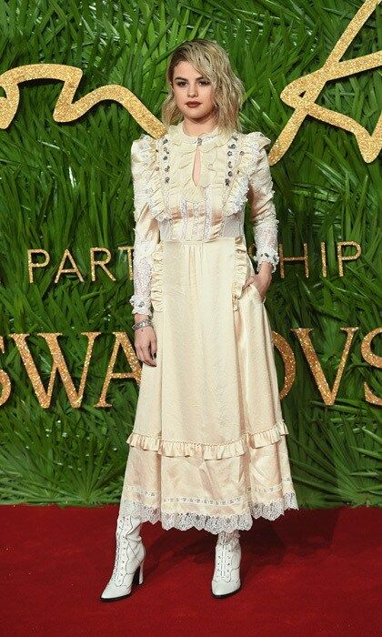 Selena Gomez opted for a monotone look from head-to-toe for the 2017 Fashion Awards in partnership with Swarovski. The <i>Wolves</i> singer wore a custom prairie-style Coach dress and styled her hair with an extreme part and waves. She told Vogue UK, "I haven't been in the space of doing the expected lately."
Photo: Getty Images