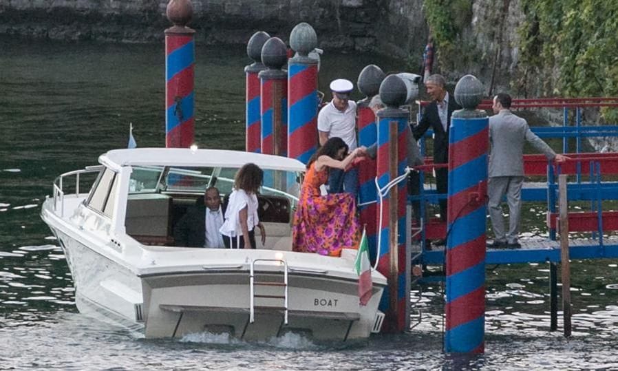 The Clooneys and Obamas were pictured disembarking a boat in Italy