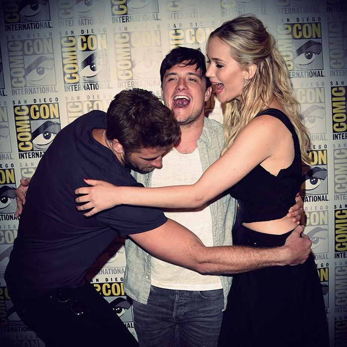 The close-knit cast of the 'Hunger Games' will say farewell to the franchise in November. Here, Jennifer cuddled up with co-stars Liam Hemsworth (L) and Josh Hutcherson at 2015's Comic-Con convention in San Diego.
<br>
Photo: Getty Images