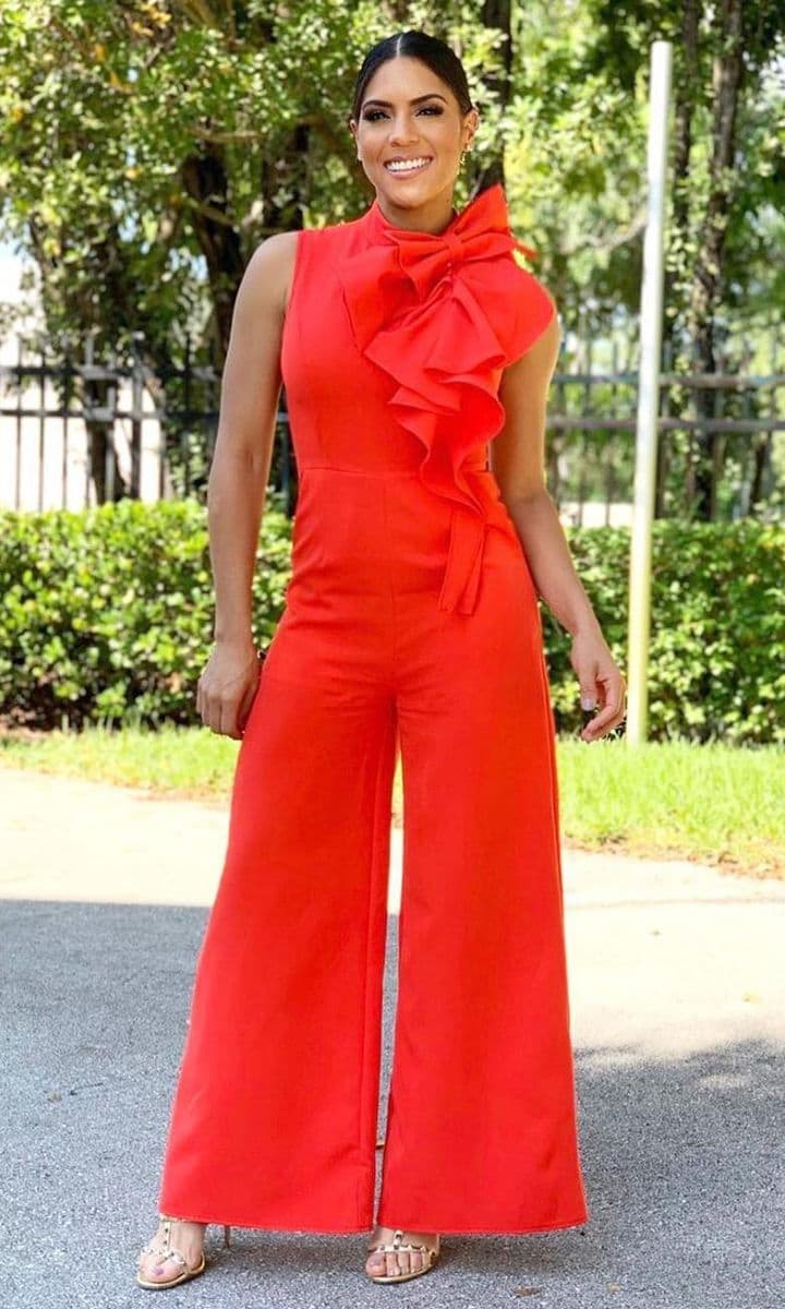 Francisca Lachapel posing for an Instagram photo in a red jumpsuit