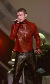 Curls no more. Justin showed off his buzz cut and all leather attire during the Grammy Awards in 2001.
<br>
Photo: Getty Images