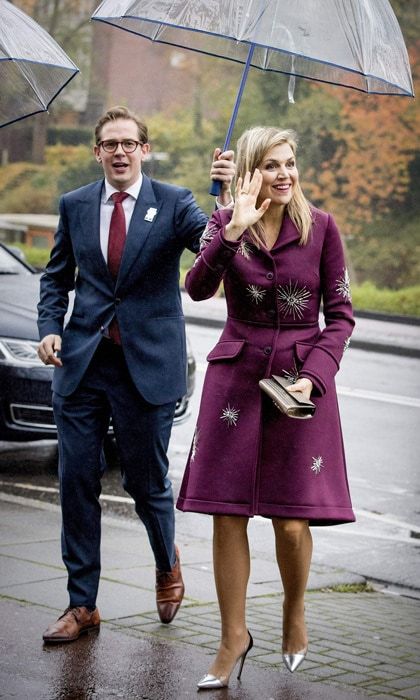 Queen Maxima was all smiles as she kept warm and dry in a plush purple coat. The royal, who went without one of her signature hats braved the rain as she arrived to kick-off a project bringing better music education to Dutch schools on November 14.
Photo: Patrick Van Katwijk/Getty Images