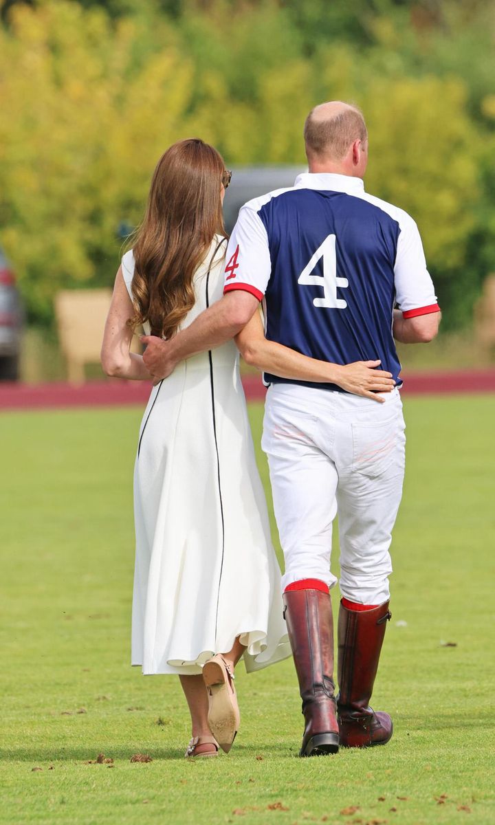 The royal couple, who celebrated their 11th wedding anniversary in April, were photographed walking with their arms wrapped around each other.