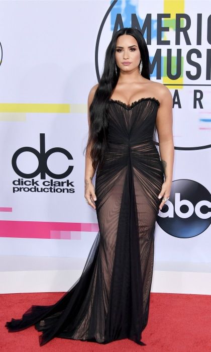 Demi Lovato brought the glam to the AMA's, opting for a gorgeous Ester Abner gown, Stuart Weitzman shoes, and Gismondi jewelry. For her date, the 25-year-old singer invited Virginia Representative Danica Roem, who was just elected as the first openly transgender legislator in the United States. "Demi Lovato and Danica Roem are two strong and inspirational women who embody the need for all Americans to stand together united and to take action today against any form of discrimination and oppression," GLAAD President and CEO Sarah Kate Ellis said in a statement. "Danica Roem is a trailblazer whose win in Virginia showcased both how young people and marginalized communities can impact voting results and how every American deserves an opportunity to work hard and achieve their dreams," she added. "Demi Lovato continues her legacy of raising the bar for entertaining audiences around the world and for spotlighting social issues that need the most attention."
Photo: Neilson Barnard/Getty Images