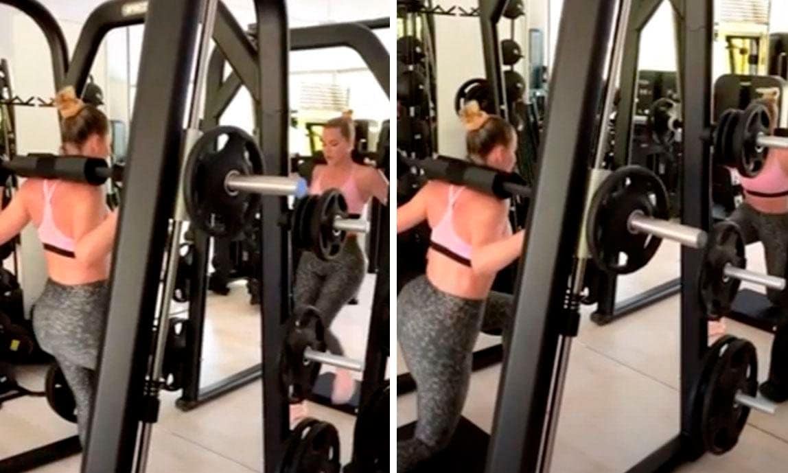 Khloé Kardashian in the gym lifting weights to work her glutes