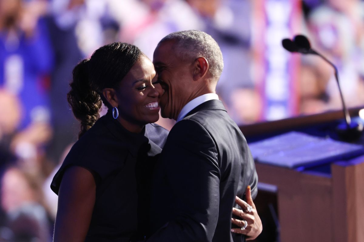  Former U.S. President Barack Obama and former first lady Michelle Obama showing affection towards each other at the Democratic National Convention in 2024