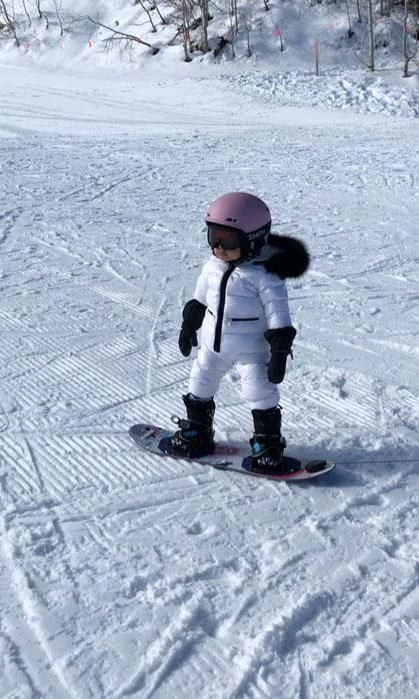 Stormi Webster shows off snowboarding skills