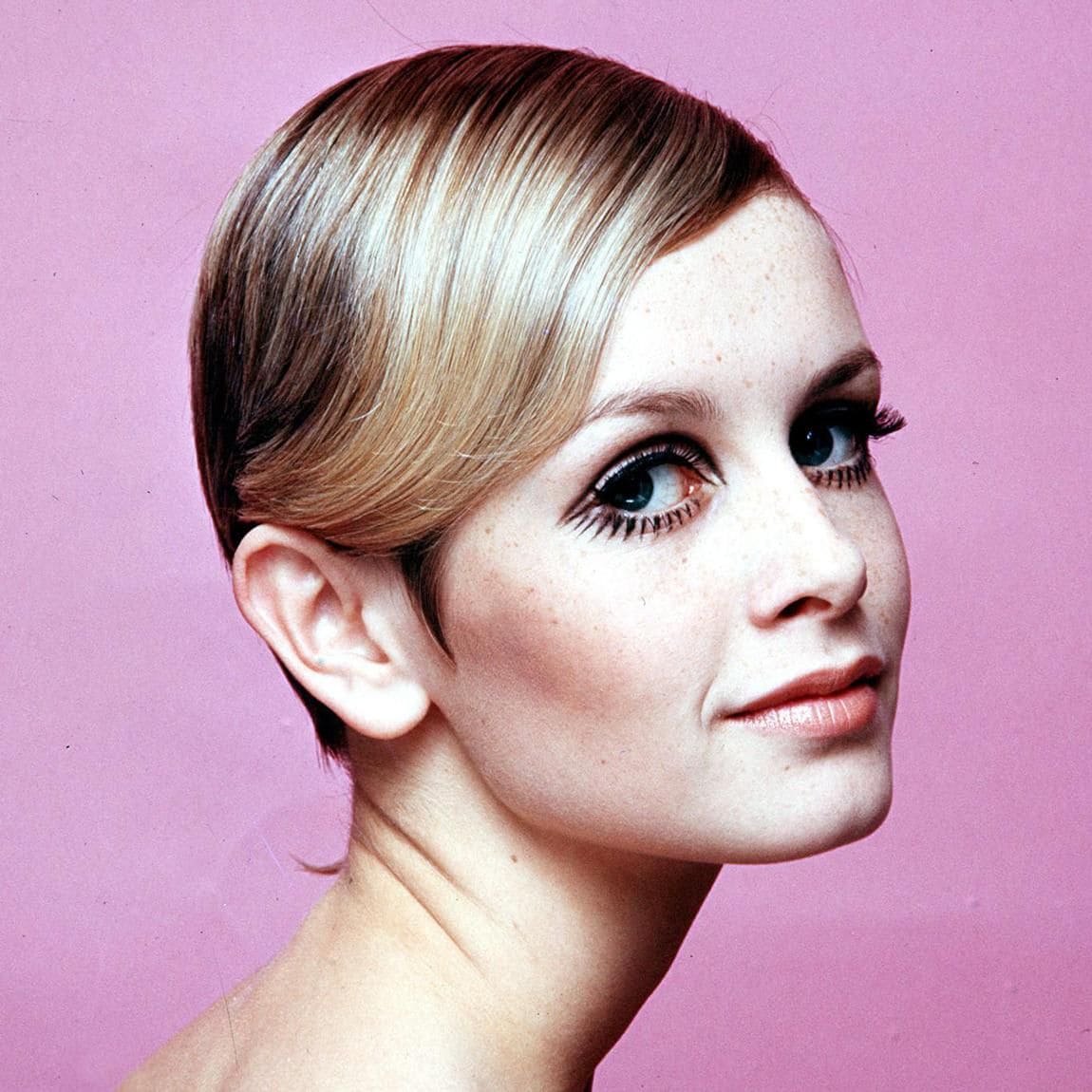 1967. Modelling. A portrait of British model Twiggy wearing black mascara.