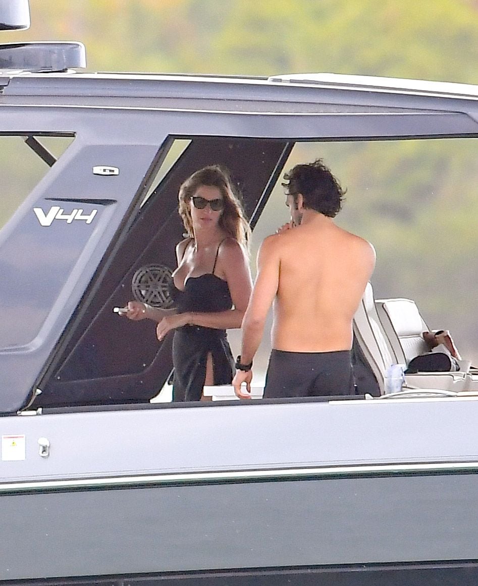 Gisele Bundchen and Joaquim Valente pack on the PDA during a boat ride with friends in Miami