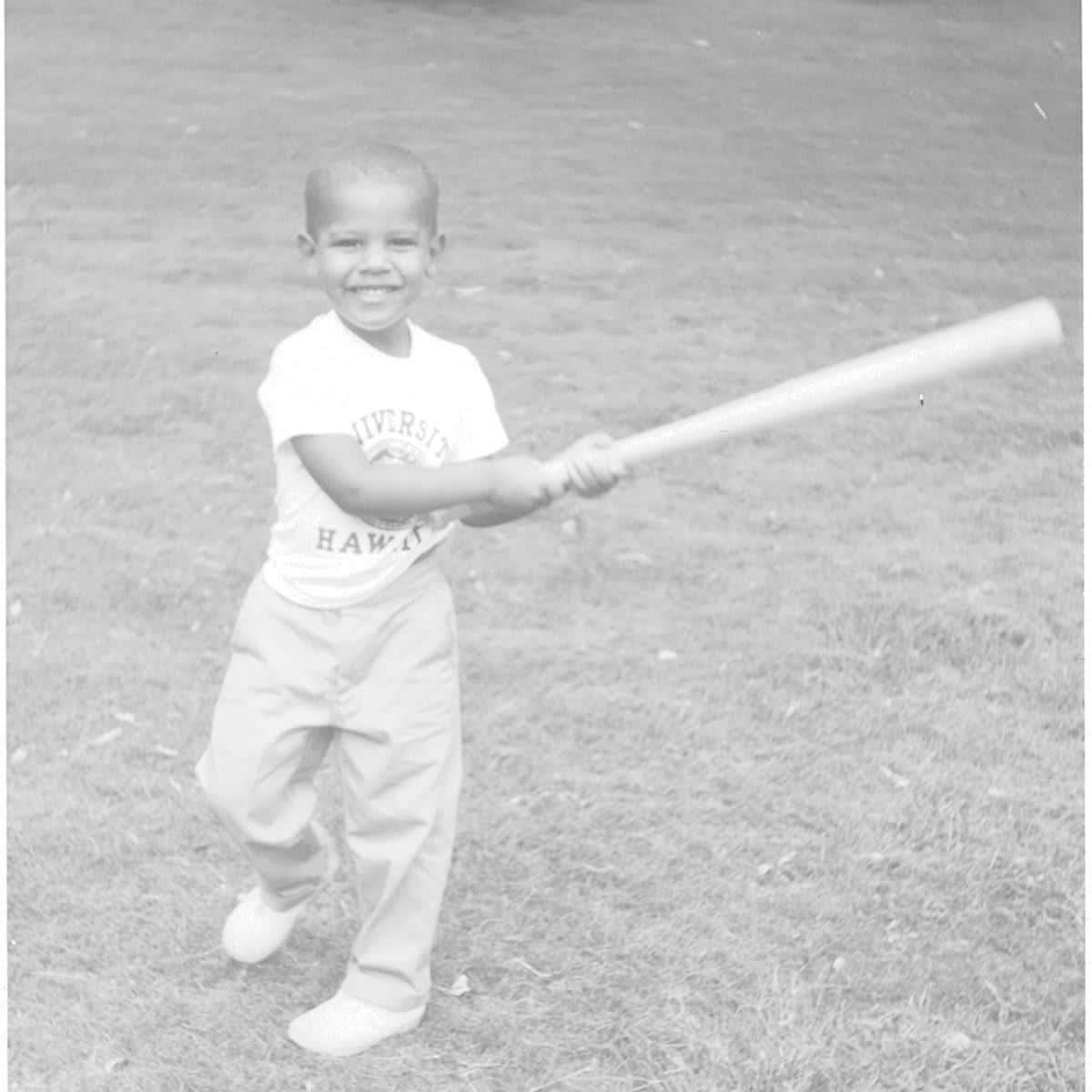 Barack Obama playing baseball as a child