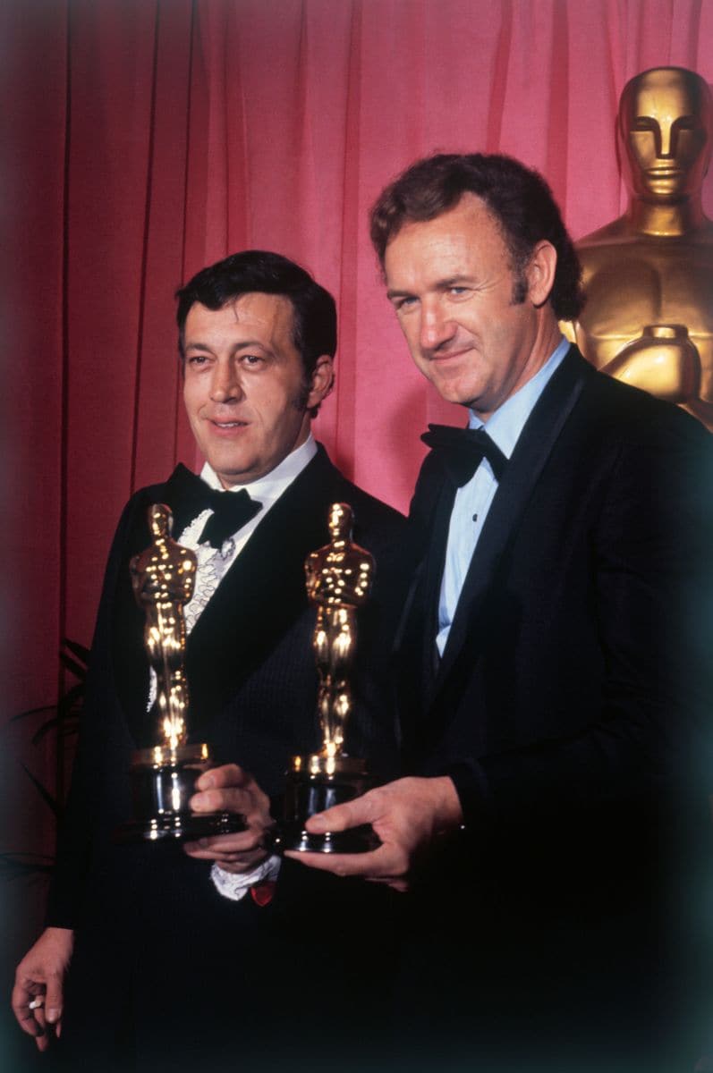 French Connection producer Phillip D' Antoni and star Gene Hackman hold the awards they won for "best picture" and "best actor" respectively at the Academy Awards ceremony.