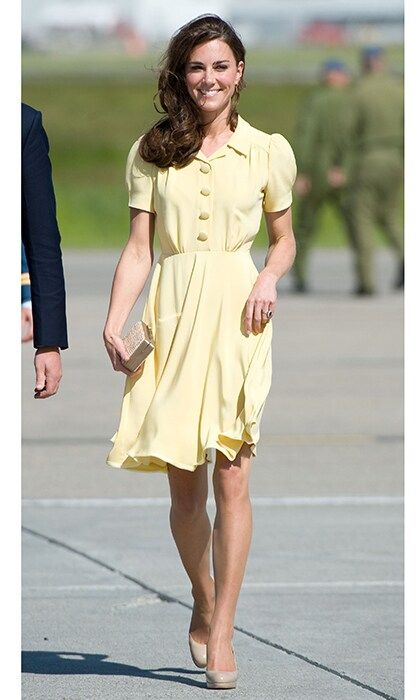 The Duchess wore this knee length primrose yellow dress, made from silk crepe during the final leg of their Canadian trip in 2011. She paired the look with her favorite L.K. Bennett pumps and a straw clutch from the designer.
<br>
Photo: Getty Images