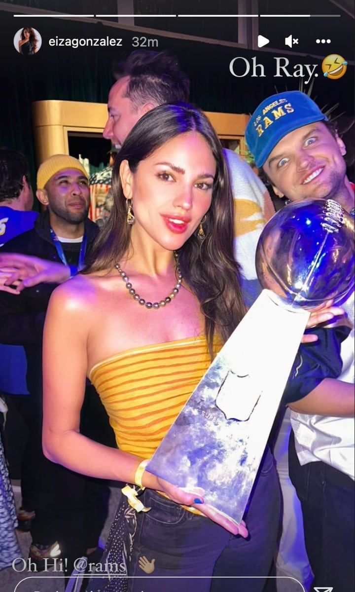 Eiza Gonzalez holding the coveted Lombardi trophy