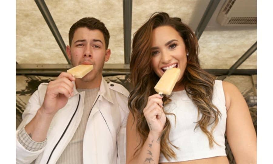 September 17: Cool for the summer! Demi Lovato had the help of her <i>Future Now</i> tour mate Nick Jonas as she handed out sweet treats and tickets to her sold out show for her upcoming Marriott Rewards Members concert.
Photo: Jesse Grant/Getty Images