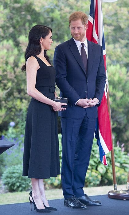 The previous day, Meghan dazzled in three chic ensembles. The final look of the day, which she wore to a garden party at Glencairn House in Dublin was by Emilia Wickstead. The belted number featured a midi-length skirt and squared neckline, and she anchored it with a pair of her favourite Aquazzura Deneuve Bow pumps bedecked with bows on the heels. A Givenchy box clutch, Birks Muse Citrine and Diamond drop earrings and an old Hollywood wave completed the elegant look.
Photo: Getty Images