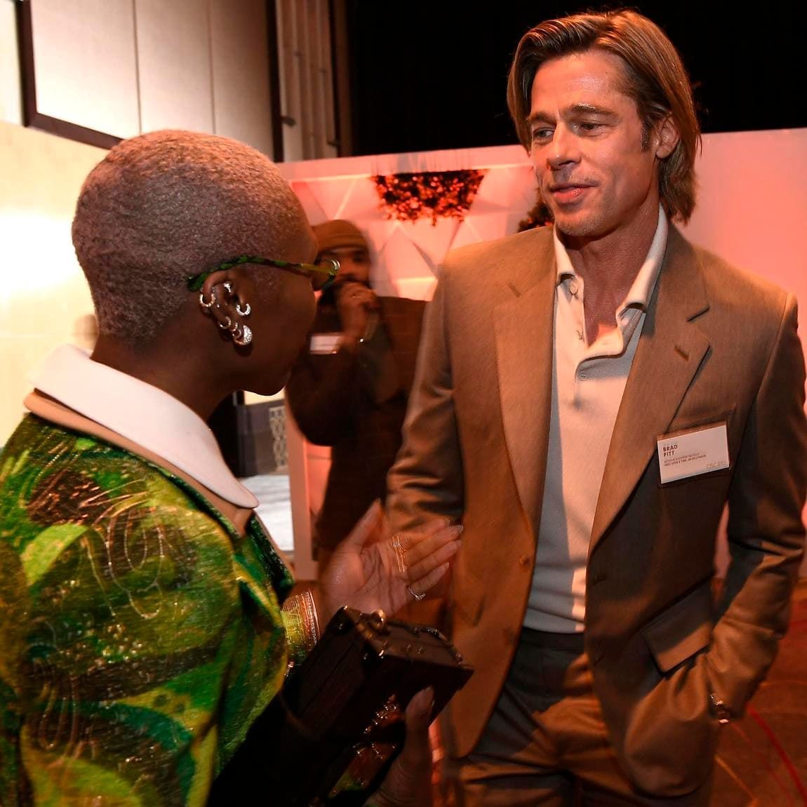 Brad Pitt wears a name tag