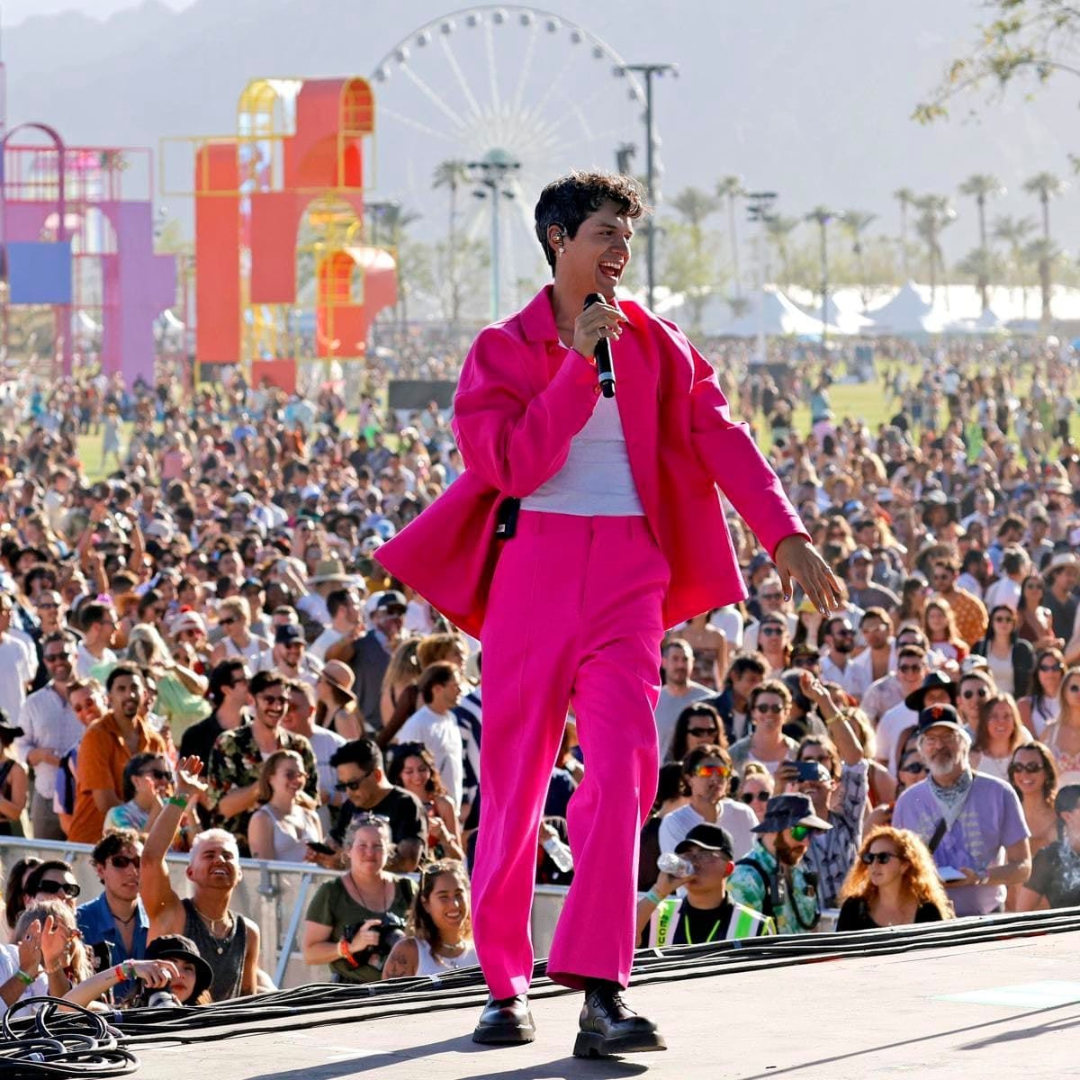 Omar Apollo performing in front of thousands of fans at Coachella 2022.