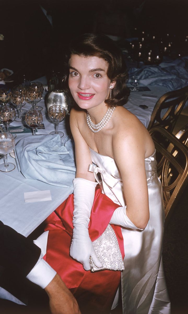 JFK's wife looked picture perfect in a strapless number, white gloves and multiple strands of pearls at the "April in Paris" ball. Like Jackie once said, "Pearls are always appropriate."