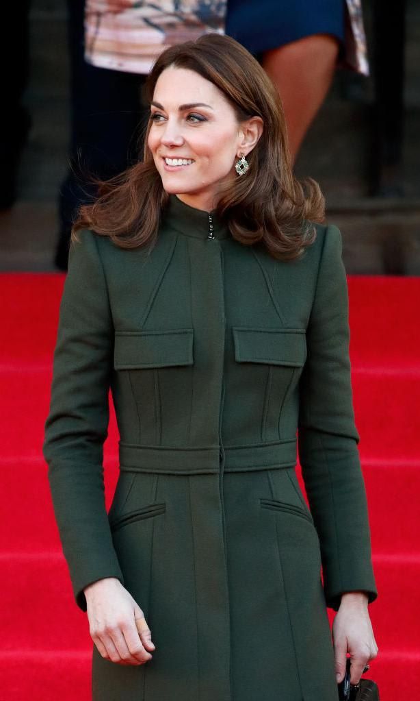 Kate Middleton wearing a dark green coat dress