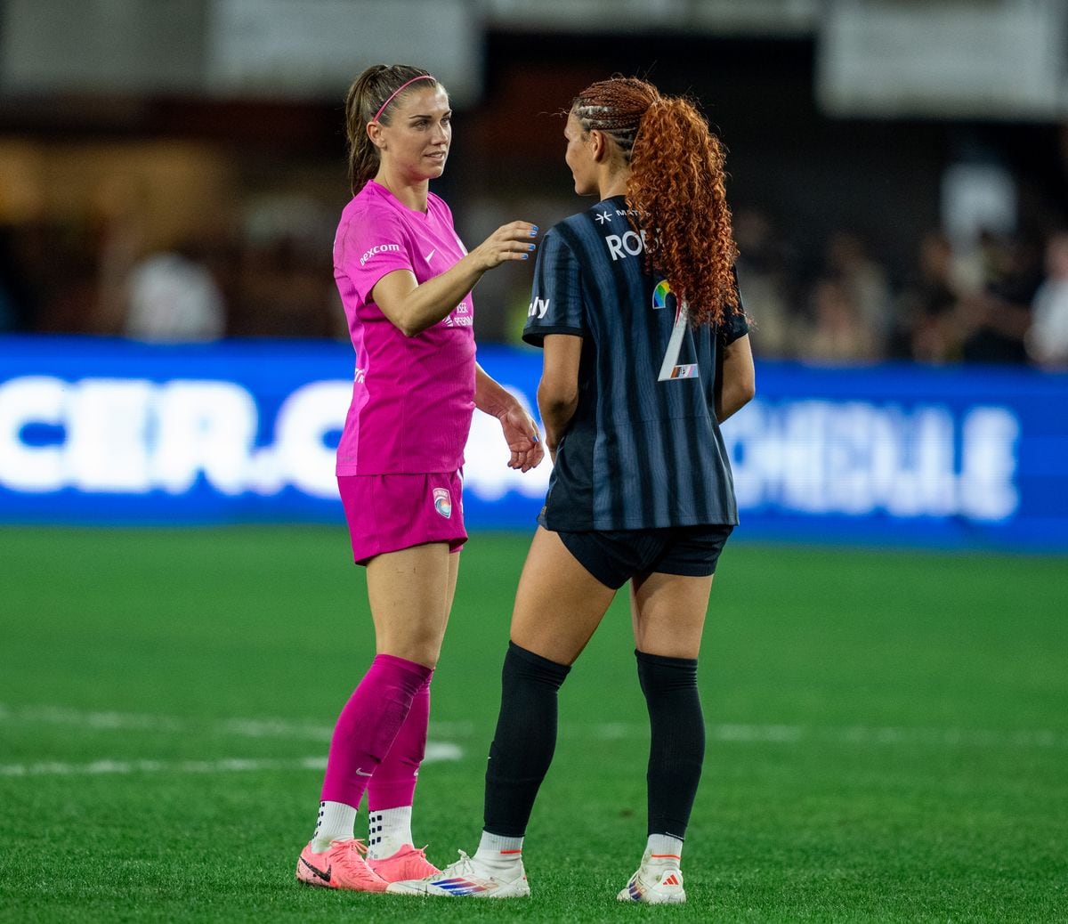 Alex Morgan, #13 of San Diego Wave FC, talks with Trinity Rodman #2 of the Washington Spirit after a game between San Diego Wave FC and Washington Spirit at Audi Field on June 15, 2024, in Washington, DC. (Photo by Brad Smith/ISI Photos/Getty Images).