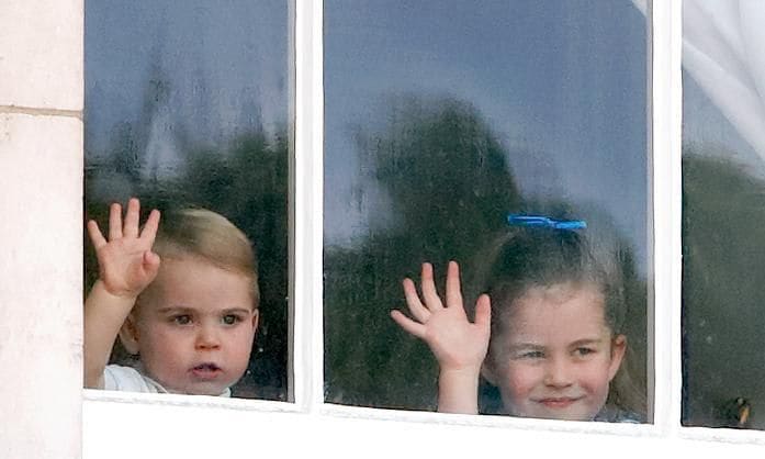 Prince George's younger siblings waved to well-wishers from a window at Buckingham Palace in 2019.