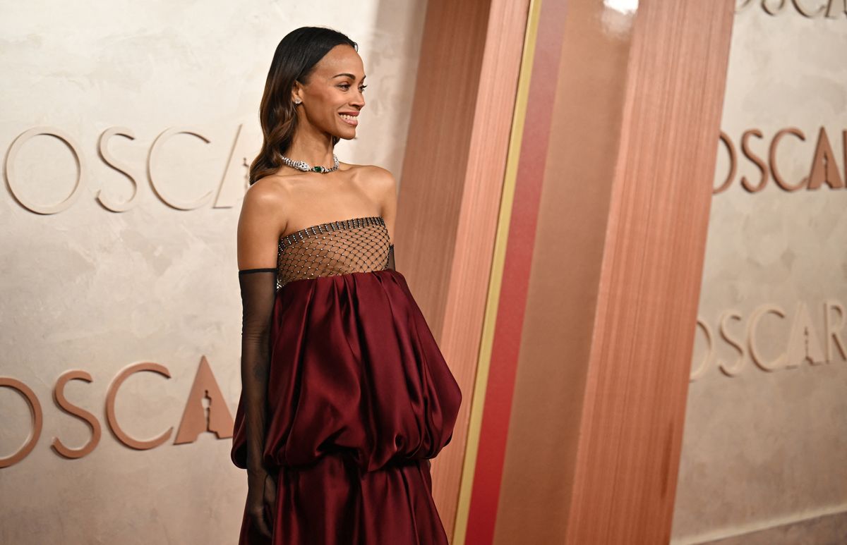 Emilia Perez actress Zoe Saldaña’s burgundy Saint Laurent look at the 2025 Oscars is pure elegance.