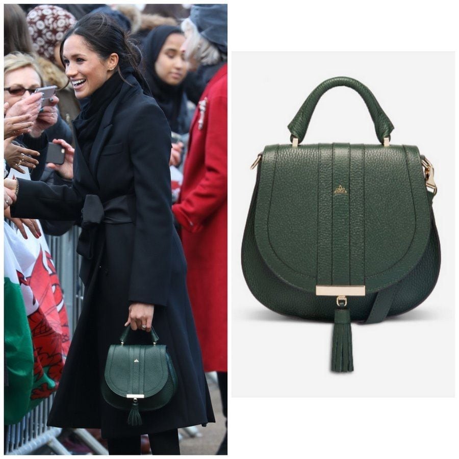 <b>The Mini Venice by DeMellier London</B>
For an outing with Harry in Cardiff, Wales in January 2018, Meghan carried this forest grain DeMellier top handle bag to accessorize her Stella McCartney coat. Described as "cute" with a "ladylike" top handle by the luxury brand, the piece has a detachable cross-body strap and can be monogrammed.
Photos: WENN, demellierlondon.com