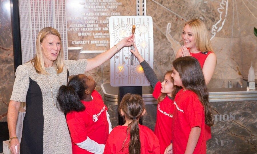 October 11: Dakota Fanning and some very lucky girl scouts lit the Empire State Building red during the International Day of the Girl in NYC.
Photo: Albin Lohr-Jones / SIPA USA/PA Images