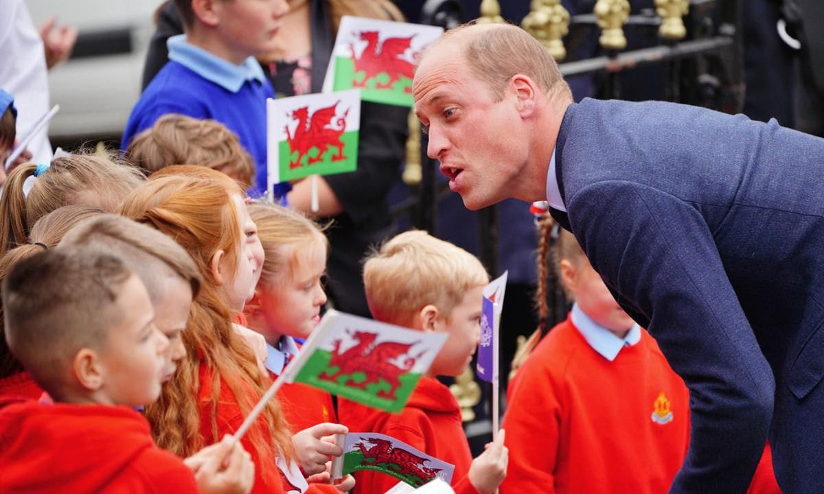 William spoke with school children as he and Catherine arrived for their visit to St Thomas Church in Swansea.