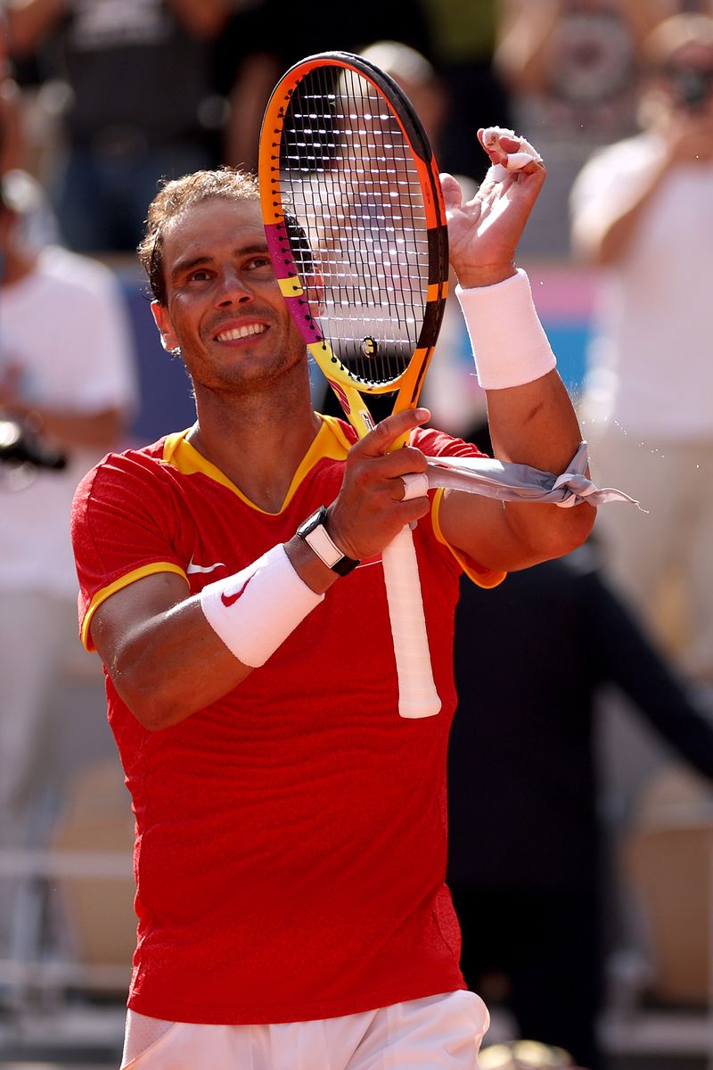 Rafael Nadal of Team Spain celebrates after winning a match point against Marton Fucsovics of Team Hungary during the Menâs Singles first round match on day two of the Olympic Games Paris 2024 at Roland Garros on July 28, 2024, in Paris, France. (Photo by Clive Brunskill/Getty Images)