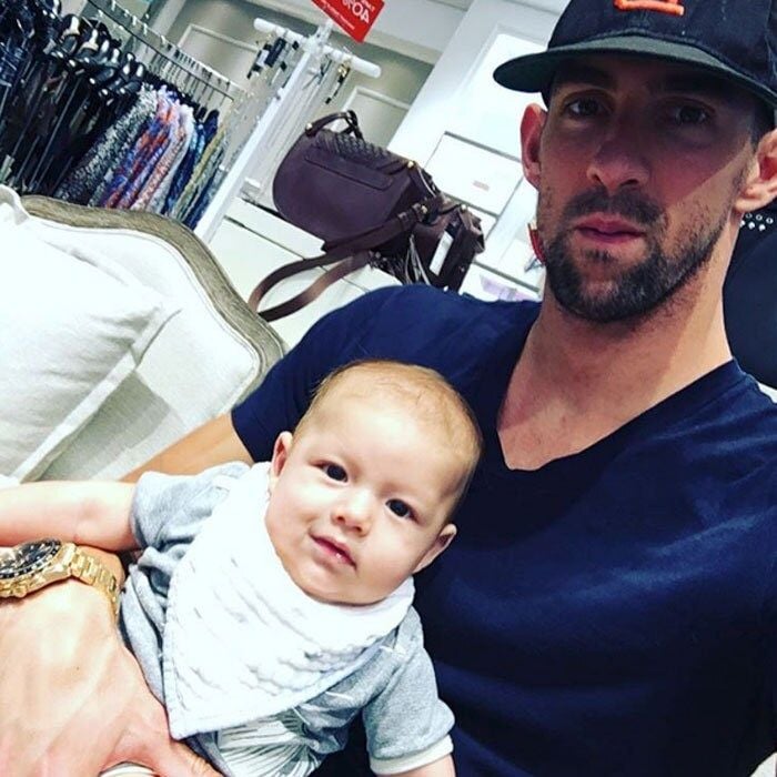 The adorable father-son duo kept each other company at a store, while mom Nicole was shopping.
</br><br>
Photo: Instagram/@boomerrphelps