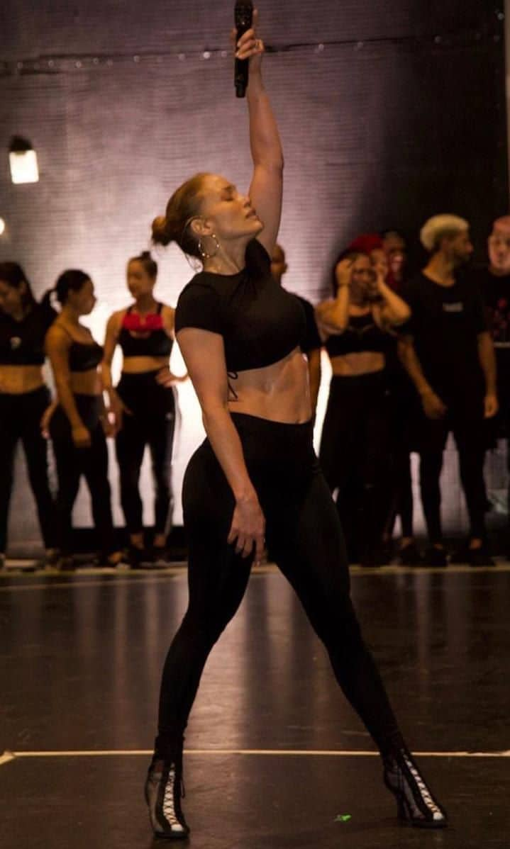 Jennifer Lopez with black athletic leggings and crop top