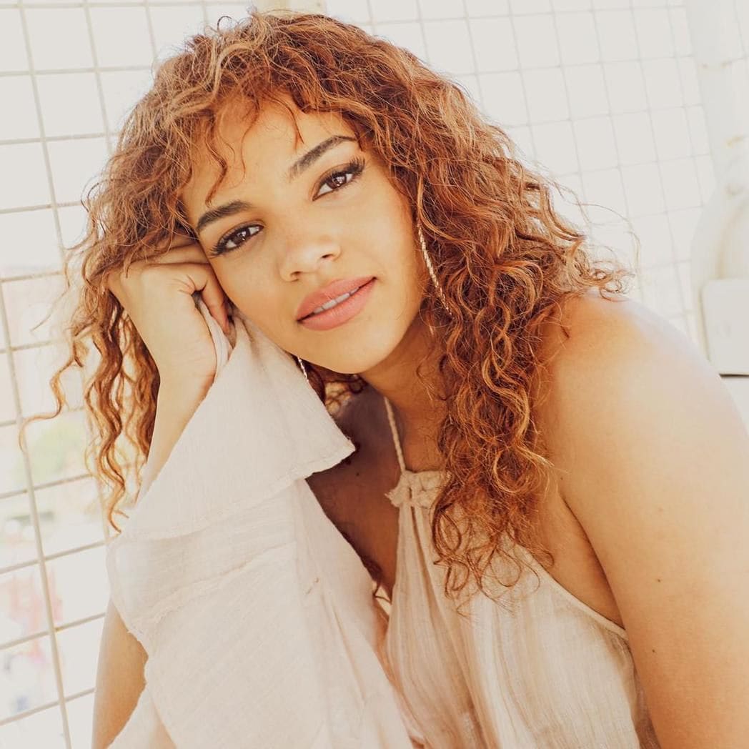 Leslie Grace curly texture bangs