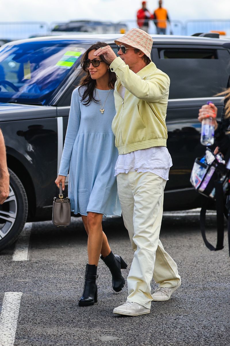 Brad Pitt, star of the upcoming 'F1' movie, arrives in the paddock with girlfriend Ines de Ramon during the F1 Grand Prix of Great Britain at Silverstone Circuit on July 7, 2024, in Northampton, United Kingdom. 