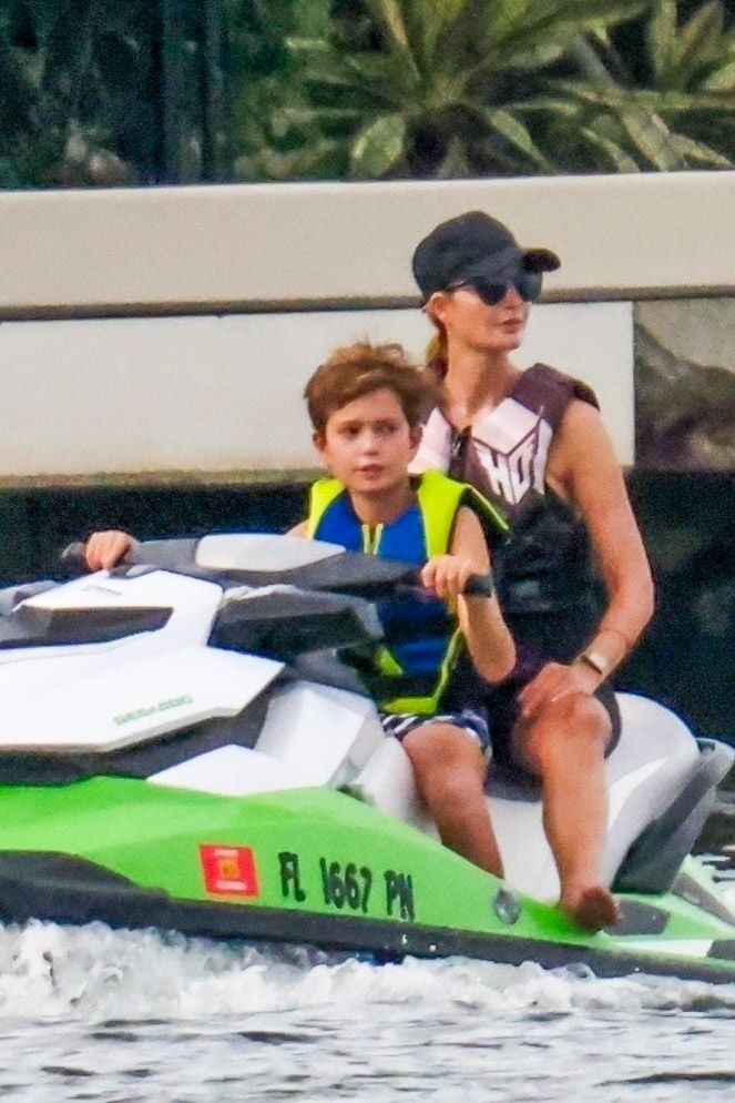 Ivanka Trump and Jared Kushner teach their kids, Joseph and Theodore, to drive jet skis in Surfside, Florida. Theodore is seen with band-aids under both eyes.