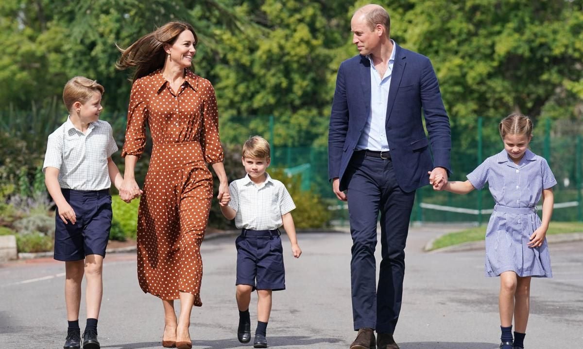 Kate held her sons' hands, while William held Charlotte's as they arrived at the school on Sept. 7.