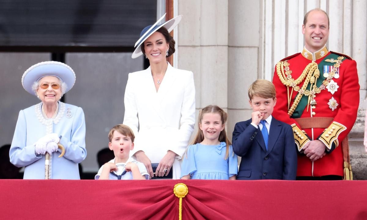 Wow! Louis appeared impressed on the balcony of Buckingham Palace in between his great-grandmother and mom.