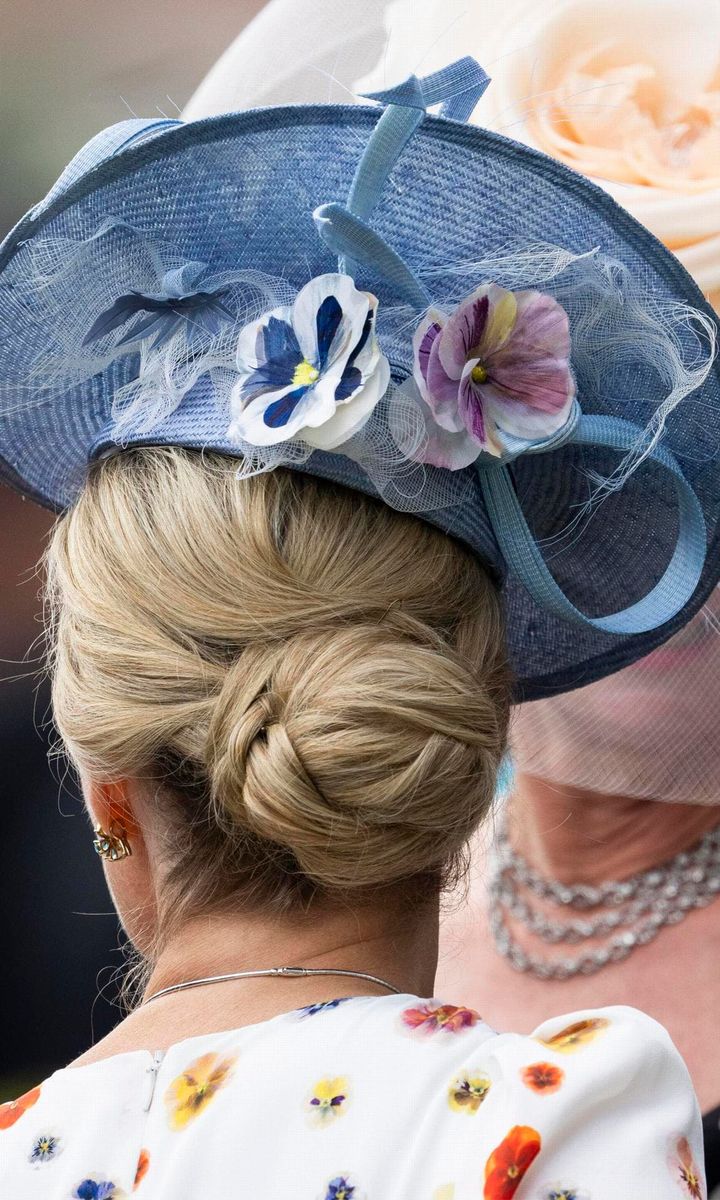 Sophie styled her hair up in an elegant updo for the summer outing.