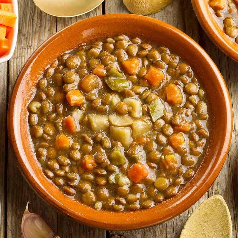 Plate of lentils with carrots and potatoes.