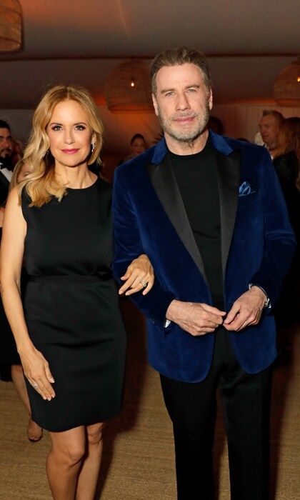 John Travolta kept his look from his latest role and paired it with a dapper blue velvet suit jacket, along with wife Kelly Preston, at Nikki Beach in Cannes. The couple attended the Hollywood Foreign Press Association (HFPA)'s celebration in association with Participant Media to award the Kailash Satyarthi Children's Foundation (KSCF), a nonprofit organization dedicated to ending violence against children, $500,000.
John and Kelly are in town to premiere <i>Gotti</i>, in which they play John and Victoria. "You want to bring the longevity, the closeness, the familiarity, and that [comfort] that you just know each other so well," Kelly told Variety of playing alongside her husband of 27 years. "They loved their family. They both loved their kids."
Kevin Connolly, who directed the film, also shared: "They were conscious of not wanting to be husband and wife playing husband and wife. They worked very hard to not have it feel that way. It was John Gotti and Victoria Gotti. It wasn't John Travolta and Kelly Preston."
Photo: Getty Images