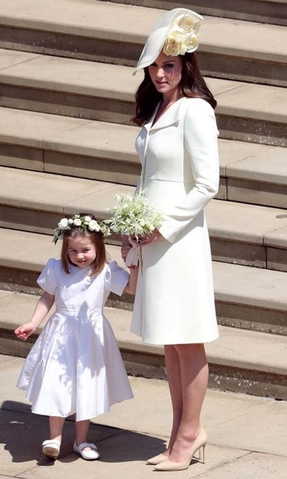 A month after welcoming her son Prince Louis, Kate Middleton wore a yellow Alexander McQueen coatdress to brother-in-law Prince Harry's wedding to Meghan Markle on May 19. Many at first thought it was the same dress she wore to Princess Charlotte's christening in 2015 as well as an outing with Prince William, but this had a slight difference: buttons on the sleeves.
Photo: Getty Images