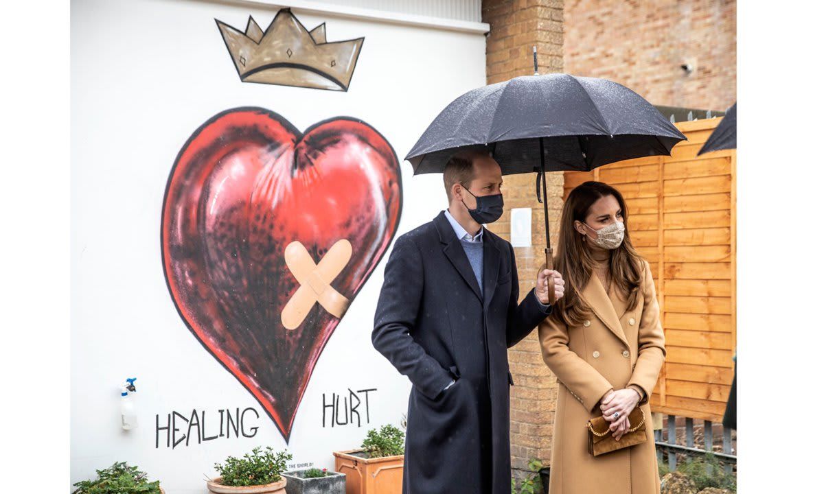 Thoughtful Prince William held an umbrella over his wife Kate Middleton's head during their outing on March 18