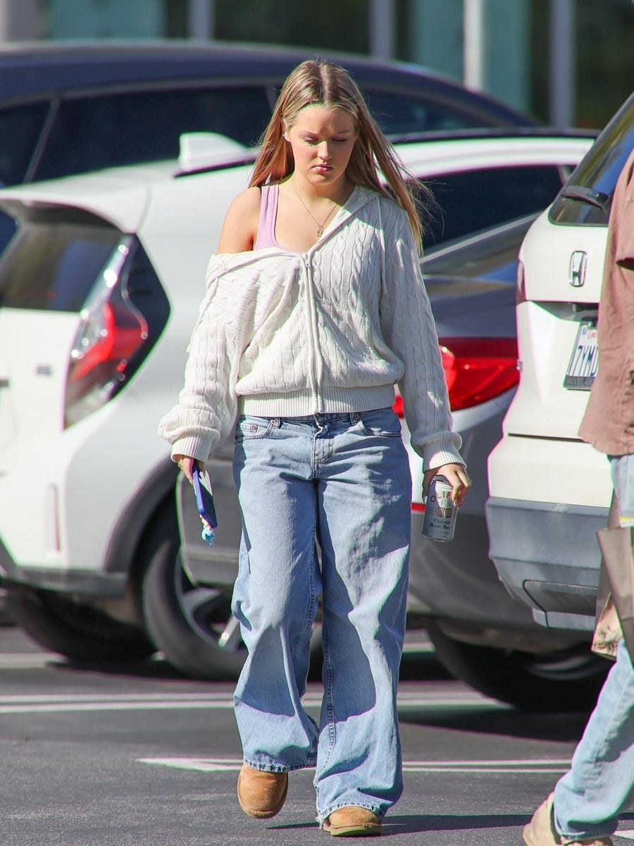 Finley wore a cable knit sweater and baggy jeans, rounding them out with Ugg boots