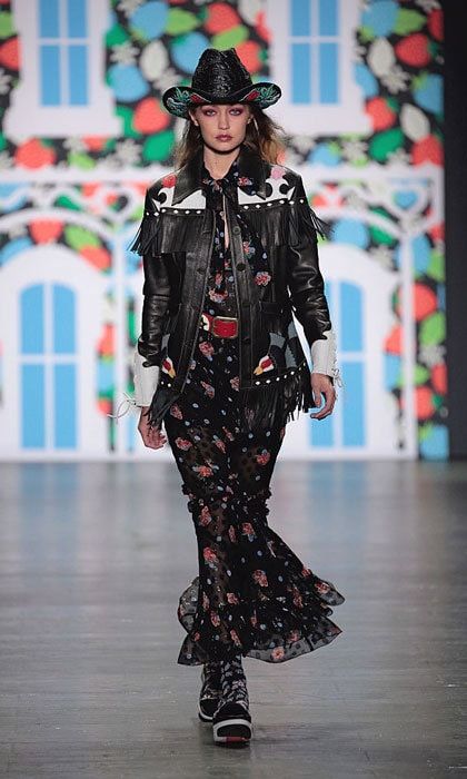 Gigi saddled up in a cowgirl-esque ensemble as she walked down the runway at the Anna Sui show.
Photo: Randy Brooke/WireImage