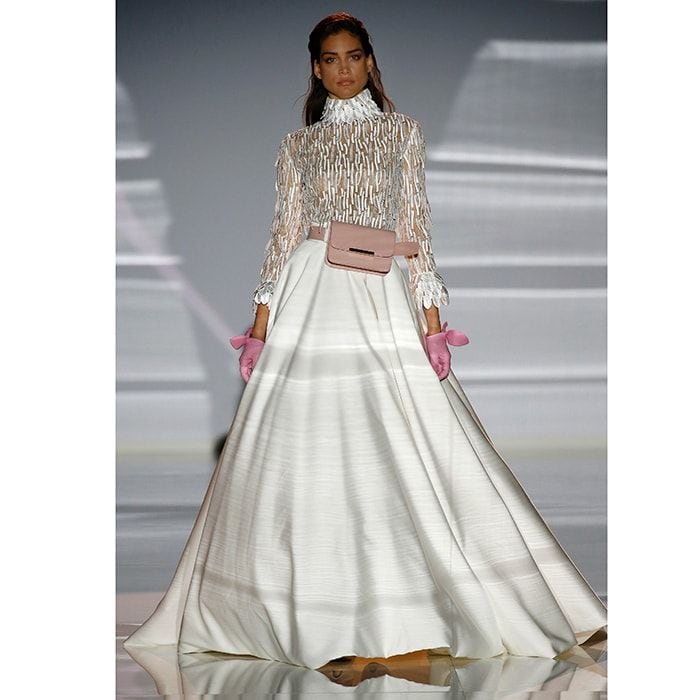 Full-skirted fabulousness from this Carla Ruiz ensemble, with an embellished high-necked top and sweet pink accessories including a trendy belt bag.
Photo: Getty Images