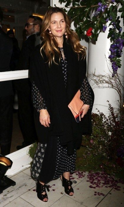 Drew Barrymore looked chic at the Club Monaco show, naturally posing next to flowers. The actress took to Instagram to thank Club Monaco for having her and her cosmetics line, Flower Beauty:
"Thank you @clubmonaco for having us, me and @flowerbeauty at your show last night!"
Photo: Laura Cavanaugh/FilmMagic/Getty Images