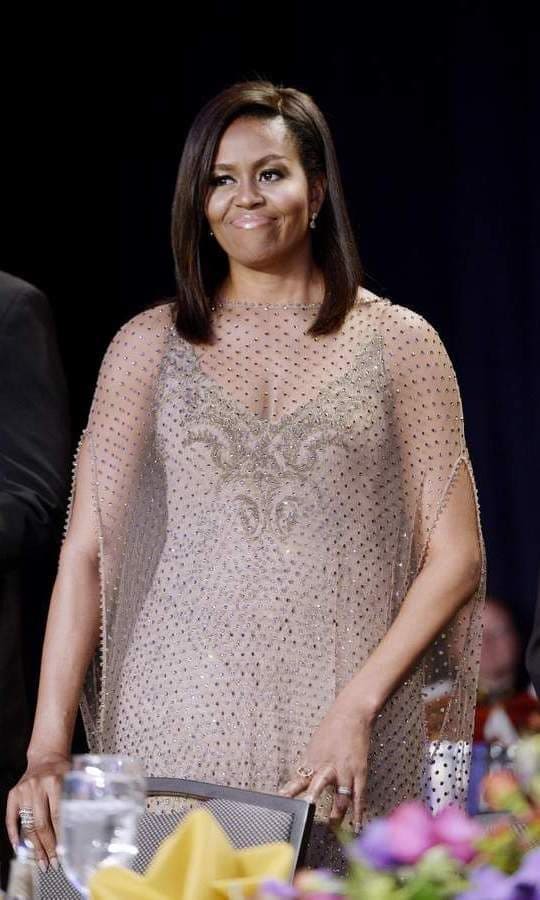 First Lady Michelle Obama wore an embroidered slip dress with sparkling overlay.
<br>
Photo: Getty Images